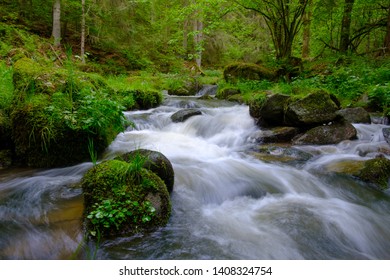 cascade on a mountain river in austria - Shutterstock ID 1408324754