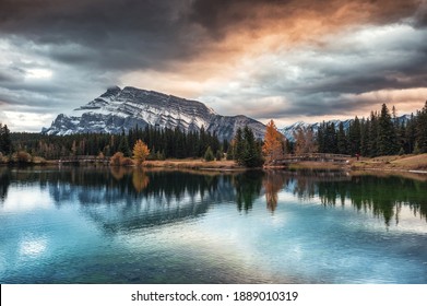 Cascade ponds with mount rundle and wooden bridge in autumn forest at Banff national park, Canada. Dranatic Tone