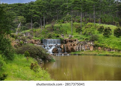 Cascade waterfall surrounded by pine forest in Da Lat, Vietnam