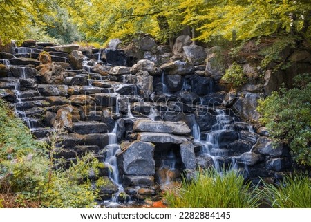 The Cascade waterfall at Virginia Water lake in Windsor Great Park, England 
