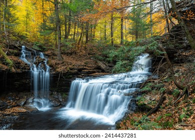 Cascade of waterfalls in a mountain gorge, fast flowing water, long exposure, Waterfalls Ricketts Glen State Park, Pennsylvania