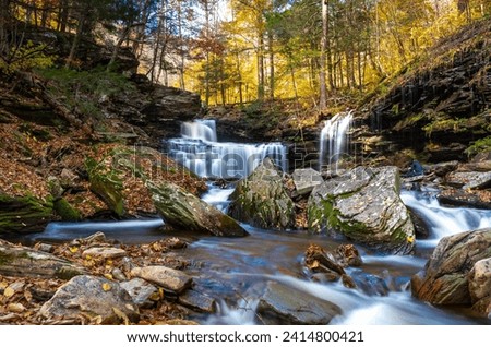 Cascade of waterfalls in a mountain gorge, fast flowing water, long exposure, Waterfalls Ricketts Glen State Park, Pennsylvania