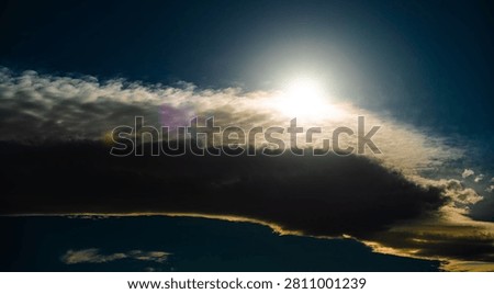 Cascading lenticular clouds morph into ragged altocumulus clouds.