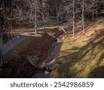 The cascading stream in the park in Bardejov spa retains water in nature.