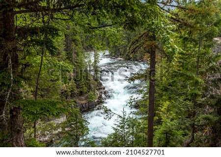 Cascading water close to the McDonald Lake in the Glacier National Park, Montana
