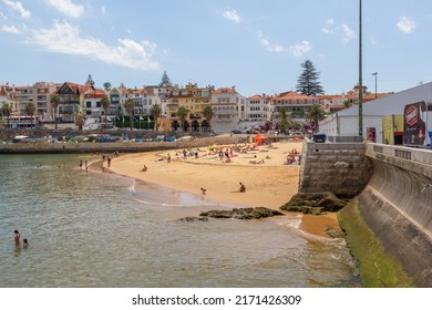Cascais, Portugal - June 22, 2018: Cascais near Lisbon, seaside town. Panoramic view of beach, filled with resting people in a summer sunny day.