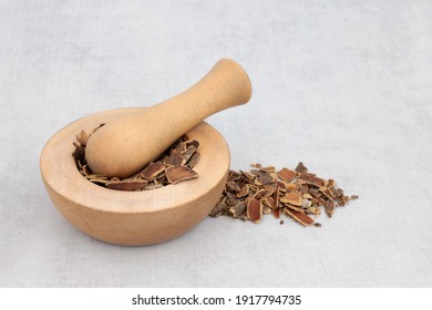  Cascara Herb Bark Used In Herbal Medicine To Treat Constipation In A Wooden Mortar With Pestle And Loose. Rhamnus Purshiana.