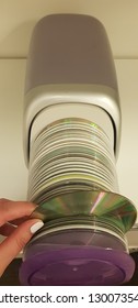 Case With Cd Disks Open Close With Hand On The Table 