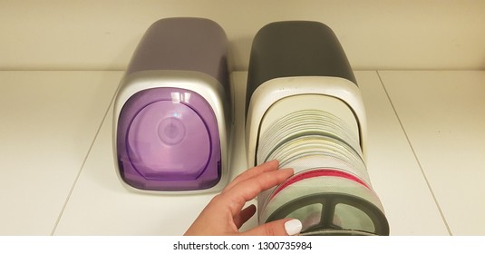 Case With Cd Disks Open Close With Hand On The Table 