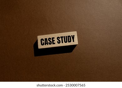 Case study message written on wooden block with brown background. Conceptual case study symbol. Copy space.