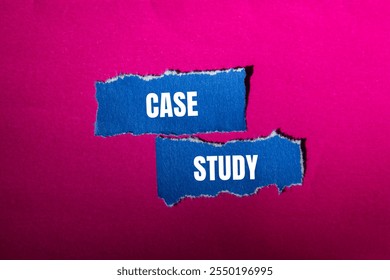 Case study message written on ripped torn blue paper pieces with pink background. Conceptual case study symbol. Copy space.