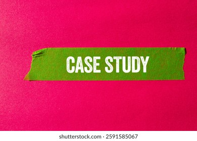 Case study message written on ripped torn green paper tape on pink background. Conceptual case study symbol. Copy space.