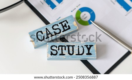 Case study text concept written on wooden blocks lying on a table