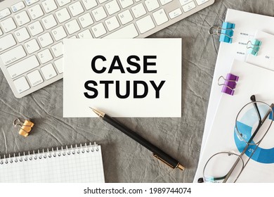 CASE STUDY is written in a document on the office desk with office accessories.