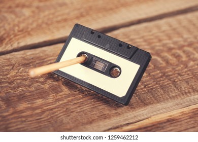 Casette With Pencil On The Table Background