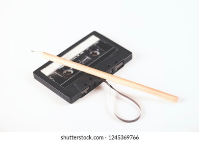 Casette With Pencil On The White Table Background