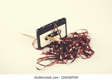 Casette With Pencil On The White Table Background