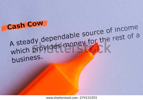 cash cow word highlighted on the white paper