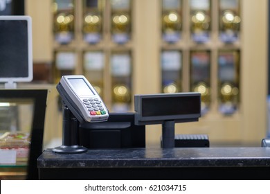 Cash Desk With Card Payment Terminal And Information Screen In Small Cafe