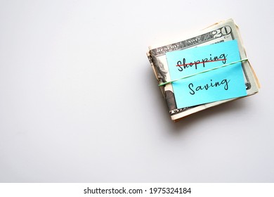 Cash Dollars Money With Blue Note Written SHOPPING (cross Out)  SAVING - Concept Of Personal Finance ,goal Setting To Start Saving Instead Of Spending Money, For Financial Security