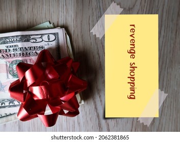 Cash Dollars Money And Red Ribbon With Note Written REVENGE SHOPPING, Concept Of Consumer Confidence Returns After COVID-19 Lock Down, Excessive Spending Money Shopping Outside Home As A Revenge