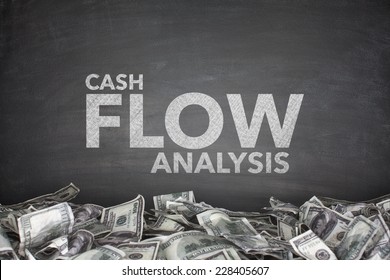 Cash Flow Analysis On Black Blackboard With Dollar Bills