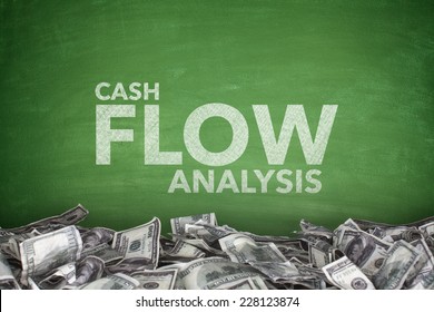 Cash Flow Analysis On Green Blackboard With Dollar Bills