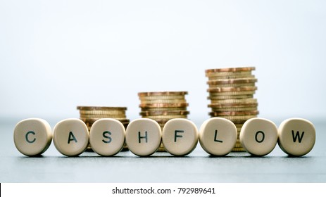 CASH FLOW Letter Block And Stack Coins, Business Concept.