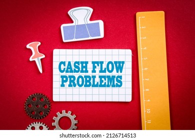 Cash Flow Problems. Office And Learning Supplies On A Red Background.