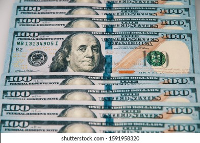 Cash hundred dollar bills, dollar background image. A row of one hundred American banknotes. - Shutterstock ID 1591958320