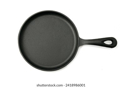 Cash Iron Frying Pan. Isolated on white. Black iron pan. Empty Cast iron skillet on a White background. Room for text. Clipping Path. Cast iron skillet. Empty frying pan. Rustic Cast-iron frying pan.
