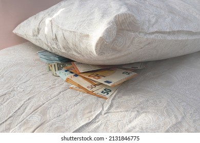 Cash Lies Under The Pillow. Storing Savings Under The Pillow Of The Bed. Distrust In Banks, The Banking System.