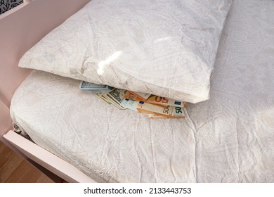 Cash Lies Under The Pillow. Storing Savings Under The Pillow Of The Bed. Distrust In Banks, The Banking System.