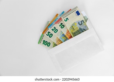 Cash money in an envelope - Shutterstock ID 2202945663