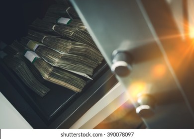 Cash Money Safe Deposit. Small Residential Vault with Pile of Cash Money. Closeup Photo. - Shutterstock ID 390078097