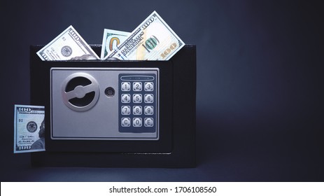 Cash Money Safe Deposit. Symbol Of Wealth And Safety. Small Residential Vault With Protruding Dollars. Toned Soft Focus Picture. Copy Space