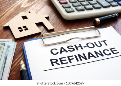 Cash out refinance documents and model of house. - Shutterstock ID 1309642597