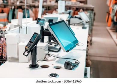 Cash register for paying for purchases in a clothing boutique with a barcode scanner and a digital terminal. Seller workplace in the mall