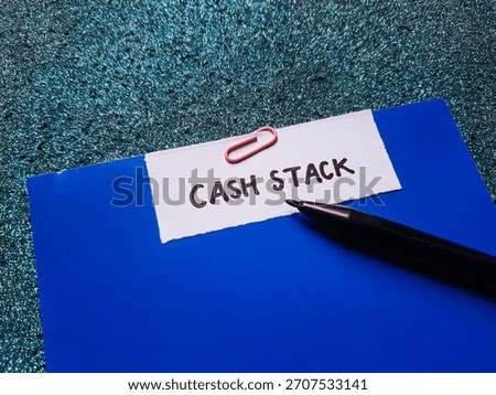 Cash stack writting on table background. 