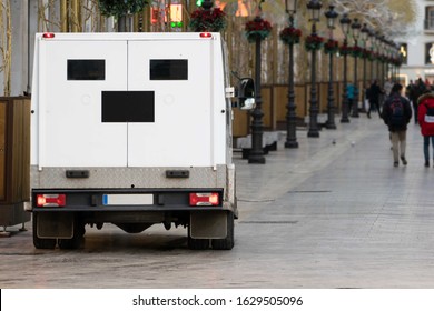 Cash Transfer Security Company Truck  Parked  In The Nice Street Of Historical City Center Of European Town.