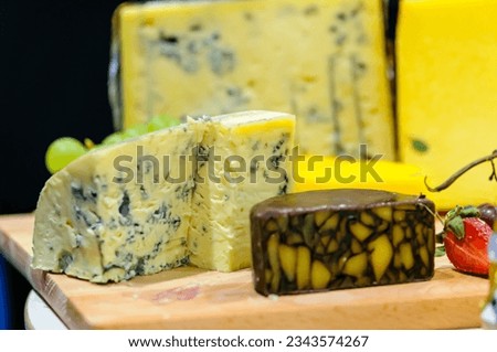 Cashel Blue, and Irish Porter Cheddar cheeses on a cheeseboard.