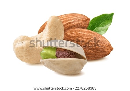Cashew, almond, pistachio in shell and green leaf isolated on white background. Package design element with clipping path