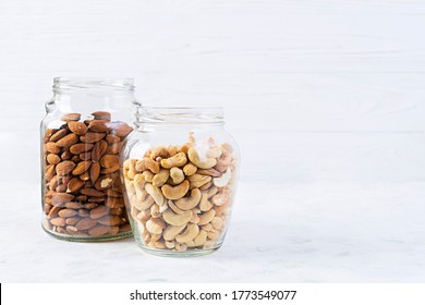 Cashew And Almonds Nuts In A Jar. Set Of Nuts Isolated On White Background