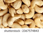 Cashew nut heap as food texture background, macro shot. Nature