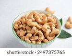 Cashew nuts in a bowl. Roasted salted cashews. Healthy snack