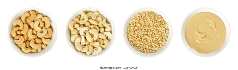 Cashew Nuts In White Porcelain Bowls. Raw And Processed Nuts. Whole, Roughly Chopped, Roasted, Salted And As Butter. Anacardium Occidentale. Seeds. Isolated Food Photo, Close Up From Above Over White.