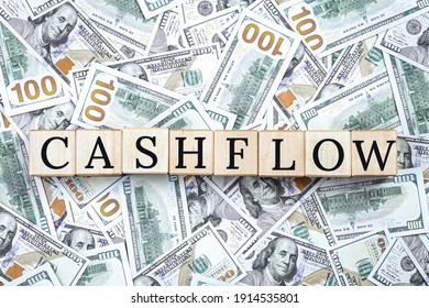 Cashflow text on us dollar notes background. 100 dollar notes