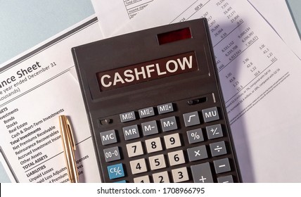 CASHFLOW word on calculator and pen on documents - Shutterstock ID 1708966795