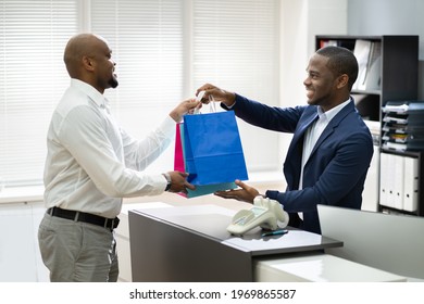 Cashier In Retail Shop Or Store At Counter