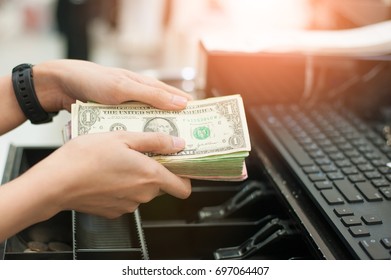 Cashier's Is Counting In Cash With Banknotes